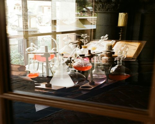 Vintage laboratory glassware and scientific equipment on a wooden table